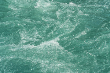 Water from melted glacier, stream fresh green cold water, global warming concept