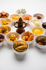 Rangoli of Assorted Indian sweets/mithai in bowl for Diwali or any other festivals, selective focus