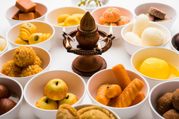 Rangoli of Assorted Indian sweets/mithai in bowl for Diwali or any other festivals, selective focus