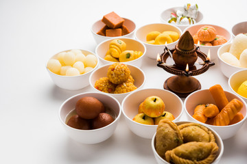 Rangoli of Assorted Indian sweets/mithai in bowl for Diwali or any other festivals, selective focus