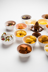 Rangoli of Assorted Indian sweets/mithai in bowl for Diwali or any other festivals, selective focus