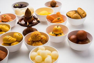 Rangoli of Assorted Indian sweets/mithai in bowl for Diwali or any other festivals, selective focus