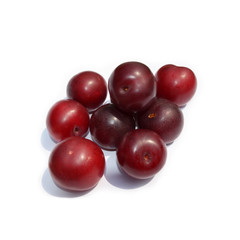fresh fruits - dark red plums isolated on white