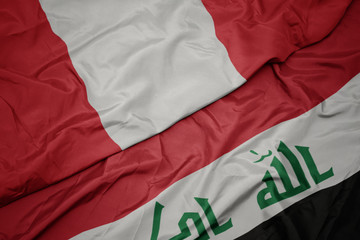 waving colorful flag of iraq and national flag of peru.