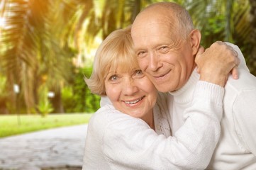 Portrait of happy senior couple smiling at home