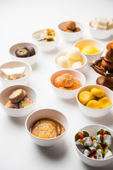 Rangoli of Assorted Indian sweets/mithai in bowl for Diwali or any other festivals, selective focus