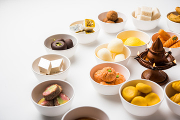 Rangoli of Assorted Indian sweets/mithai in bowl for Diwali or any other festivals, selective focus