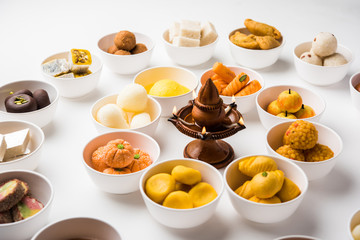 Rangoli of Assorted Indian sweets/mithai in bowl for Diwali or any other festivals, selective focus