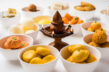 Rangoli of Assorted Indian sweets/mithai in bowl for Diwali or any other festivals, selective focus