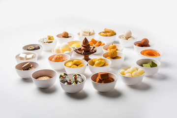 Rangoli of Assorted Indian sweets/mithai in bowl for Diwali or any other festivals, selective focus