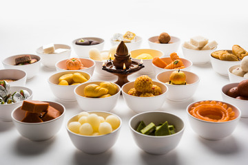 Rangoli of Assorted Indian sweets/mithai in bowl for Diwali or any other festivals, selective focus