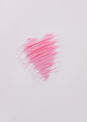Hand drawn shape of the heart. Sample of pink lip gloss on a white background.