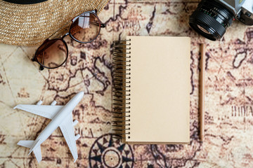 Fototapeta na wymiar Flat lay traveler accessories on map background with copy space for text. Top view travel or vacation concept.