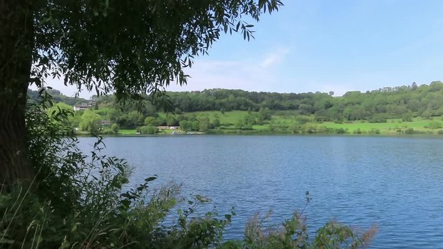 Landscape of Schalkenmehrener Maar lake in Eifel region of Germany. Volcanic crater landscape.