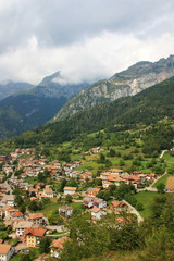 Fototapeta na wymiar Italian town at the foot of the Alps
