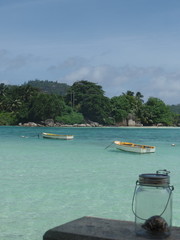 Fototapeta na wymiar Boats in the turquoise waters of the Seychelles