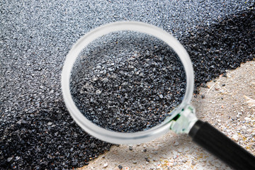 New asphalt road background - Concept image seen through a magnifying glass