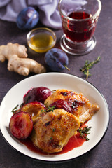 Chicken thighs and plums in ginger, honey and red wine sauce with thyme. Dish ingredients on the table