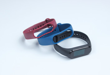 Smart watch with interchangeable bracelets on white background. Fitness tracker. Modern gadgets