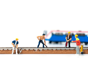 Selective focus miniature people team repair train tracks, The foreman ordered the railway...