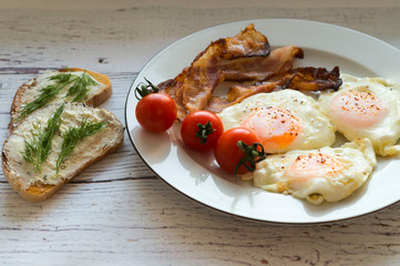 Morning breakfast - scrambled eggs, bacon, cheese sandwiches