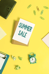 Text sign showing Summer Sale. Business photo showcasing Annual discount events that takes place during summer season Pile of empty papers with copy space on the table