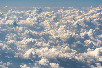 White clouds and sky, a view from airplane window