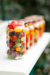 Cans with cherry tomatoes home canning on the table