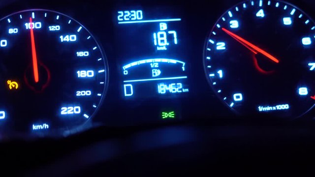 Closeup dashboard of mileage car,speed number, driving at night