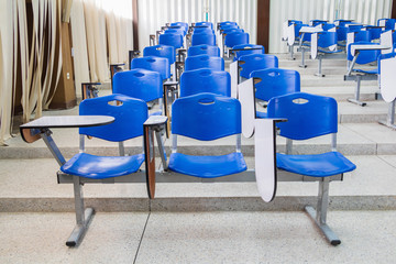 row lecture chair plastic blue in class meeting room on terrazzo floor : Select focus with shallow...
