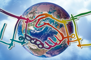 Handshake against a planet Earth - Global collaboration concept image. - Photo composition with...