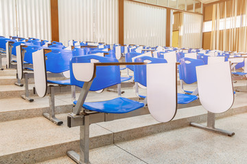 row lecture chair plastic blue in class meeting room on terrazzo floor : Select focus with shallow...