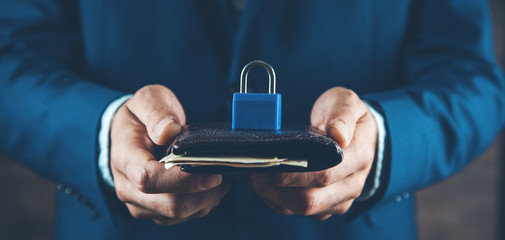 man hand holding lock in money on wallet