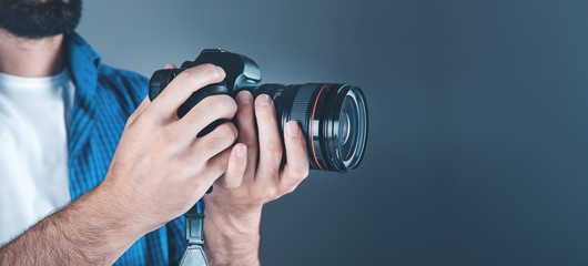 photographer hand camera on gray background