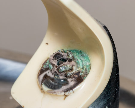 Old Drinking Water Fountain In Hallway Leaking Water At Spout Causing Unhealthy Mold To Grow