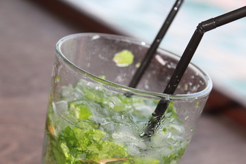Mojito on the rocks. Summer, sea and alcohol on the background of the yacht.