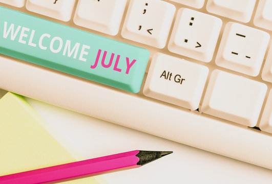 Handwriting text Welcome July. Conceptual photo Calendar Seventh Month 31days Third Quarter New Season White pc keyboard with empty note paper above white background key copy space