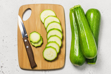 Sliced zuccini on concrete background. Top view, space for text.