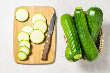 Sliced zuccini on concrete background. Top view, space for text.