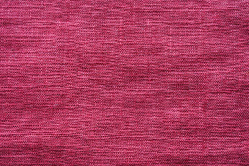 Red linen cloth texture. Natural fabric material background