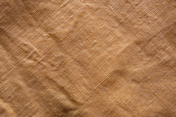 Orange linen cloth texture. Natural fabric material background