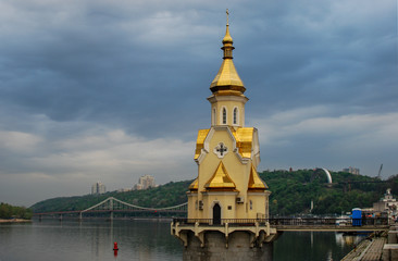 Naklejka premium the orthodox church on the river in kyiv