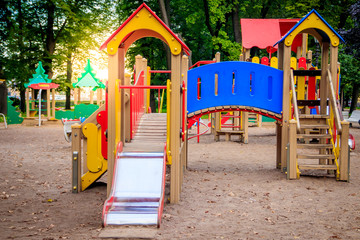 Fototapeta na wymiar City playground. Children's entertainment. Slides and swings.