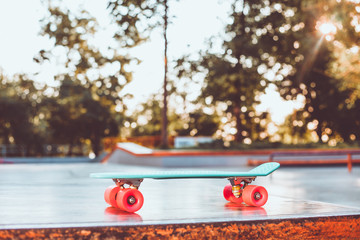 Youth plastic skateboard in a skatepark. Youth Summer Concept © splitov27
