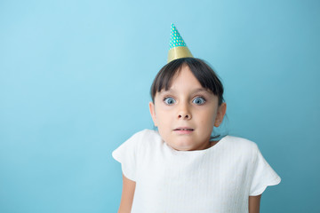 Playful girl with party hat