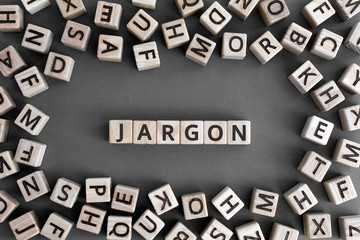 Jargon  - word from wooden blocks with letters,  special words and phrases jargon concept, random letters around, top view on grey background - obrazy, fototapety, plakaty