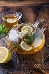 Tea with lemon and mint on a wooden table