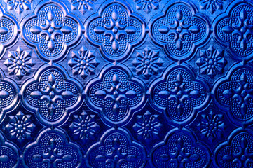 Blue embossed frosted glass, retro glass window craft, close up glass background.