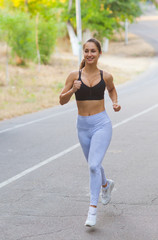 Healthy lifestyle concept. Morning running. Young woman running outdoors
