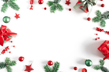 Christmas holiday composition. Xmas gifts and decorations, berries, fir tree branches on white background. Christmas, New Year, winter concept. Flat lay, top view, copy space